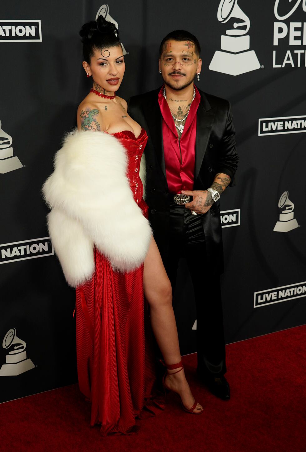 Cazzu, izquierda, y Christian Nodal llegan a la gala en honor a Marco Antonio Solís, Persona...